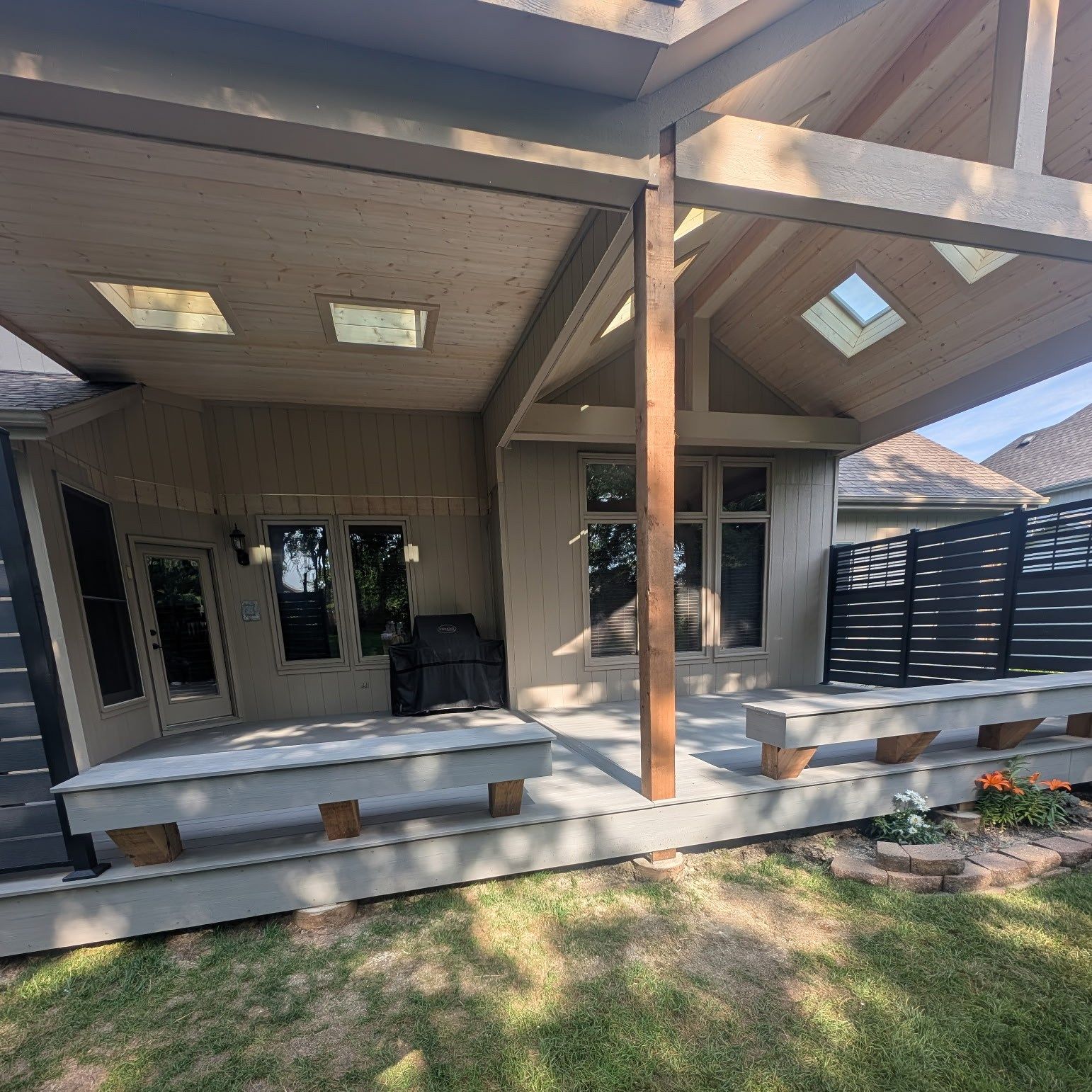 A house with a covered porch and stairs in the backyard