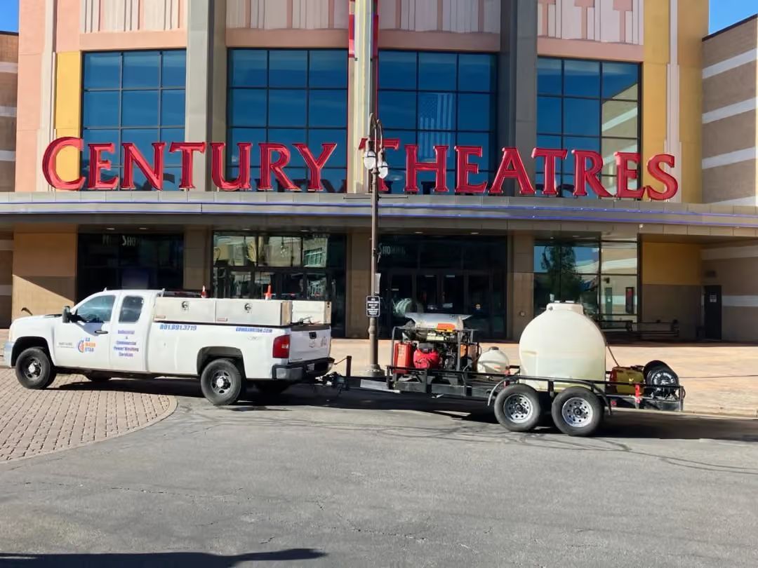 Century Theatres entrance with a white truck and utility trailer parked out front