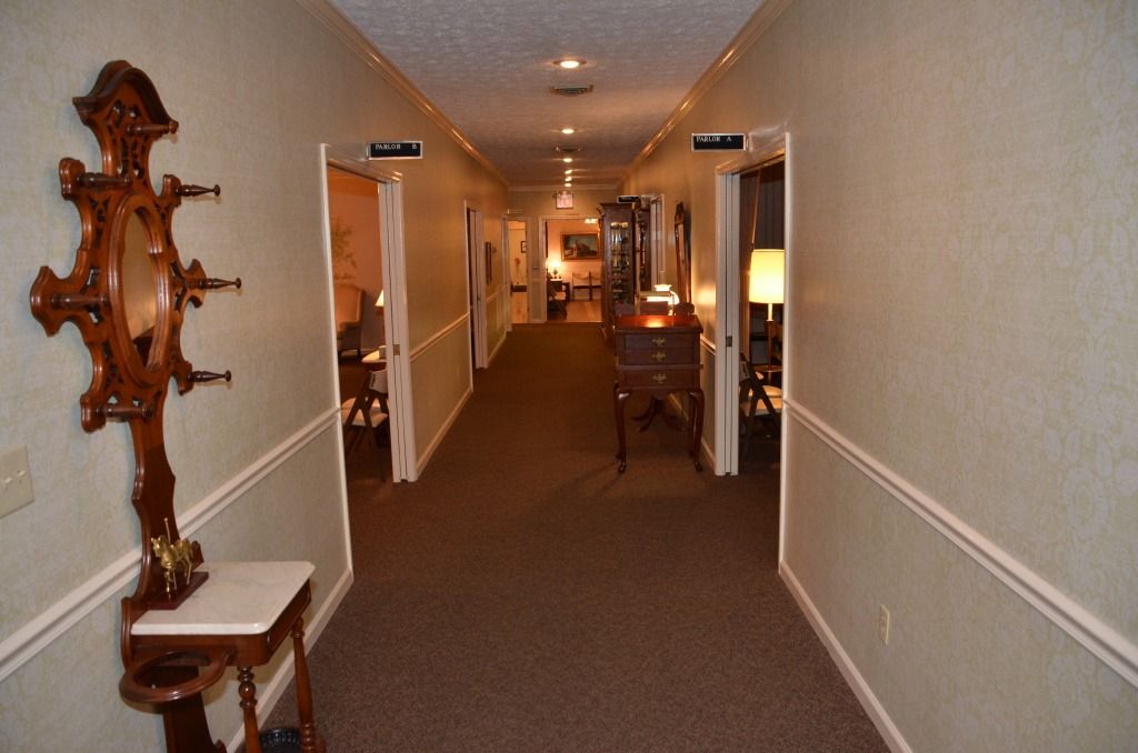 A long hallway with a clock on the wall