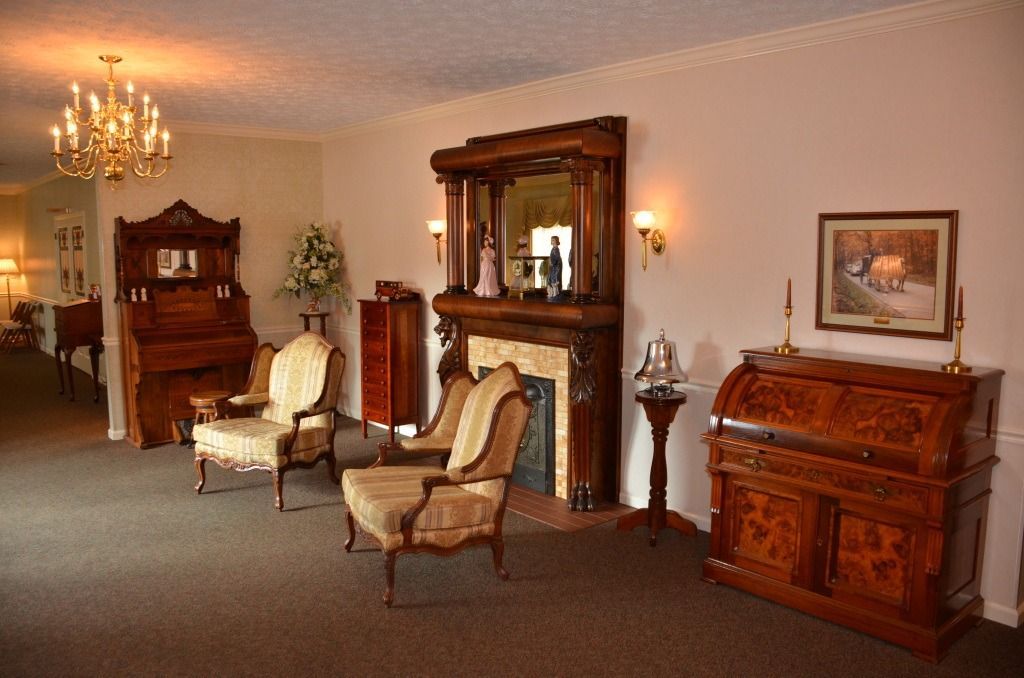 A living room filled with furniture and a fireplace