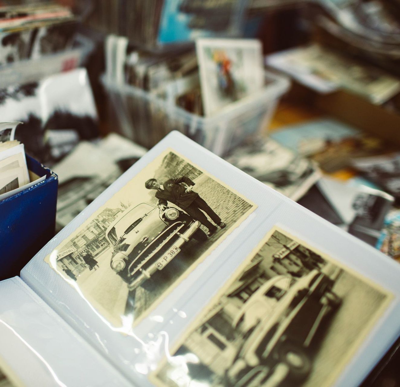 A black and white photo album with a car in it