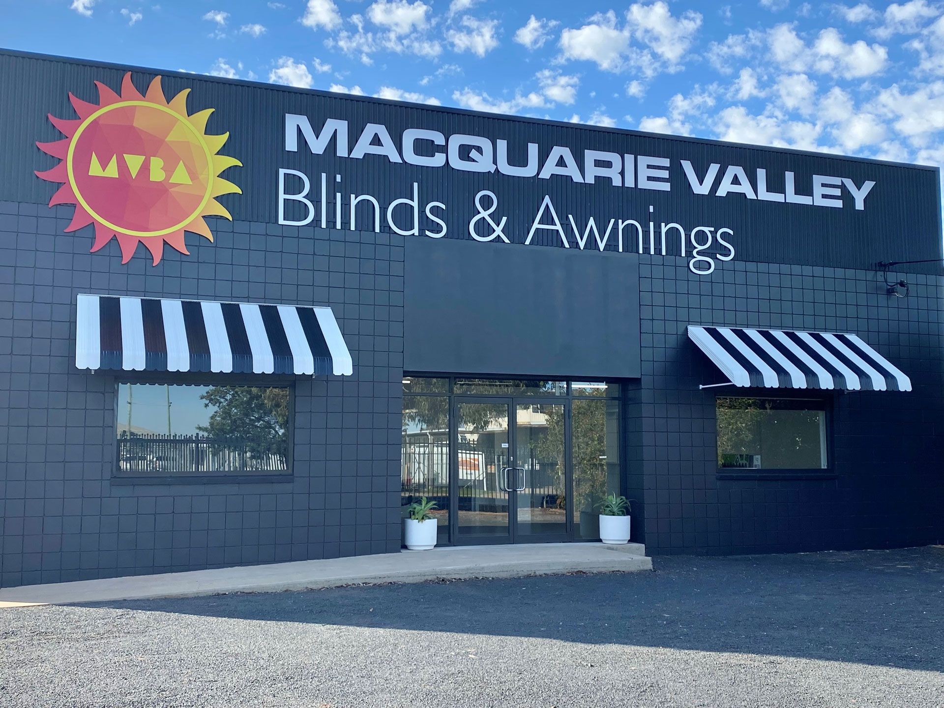 Fixed steel awnings on the building facade of Macquarie Valley Blinds & Awnings at 20 Hawthorn Street, DUBBO
