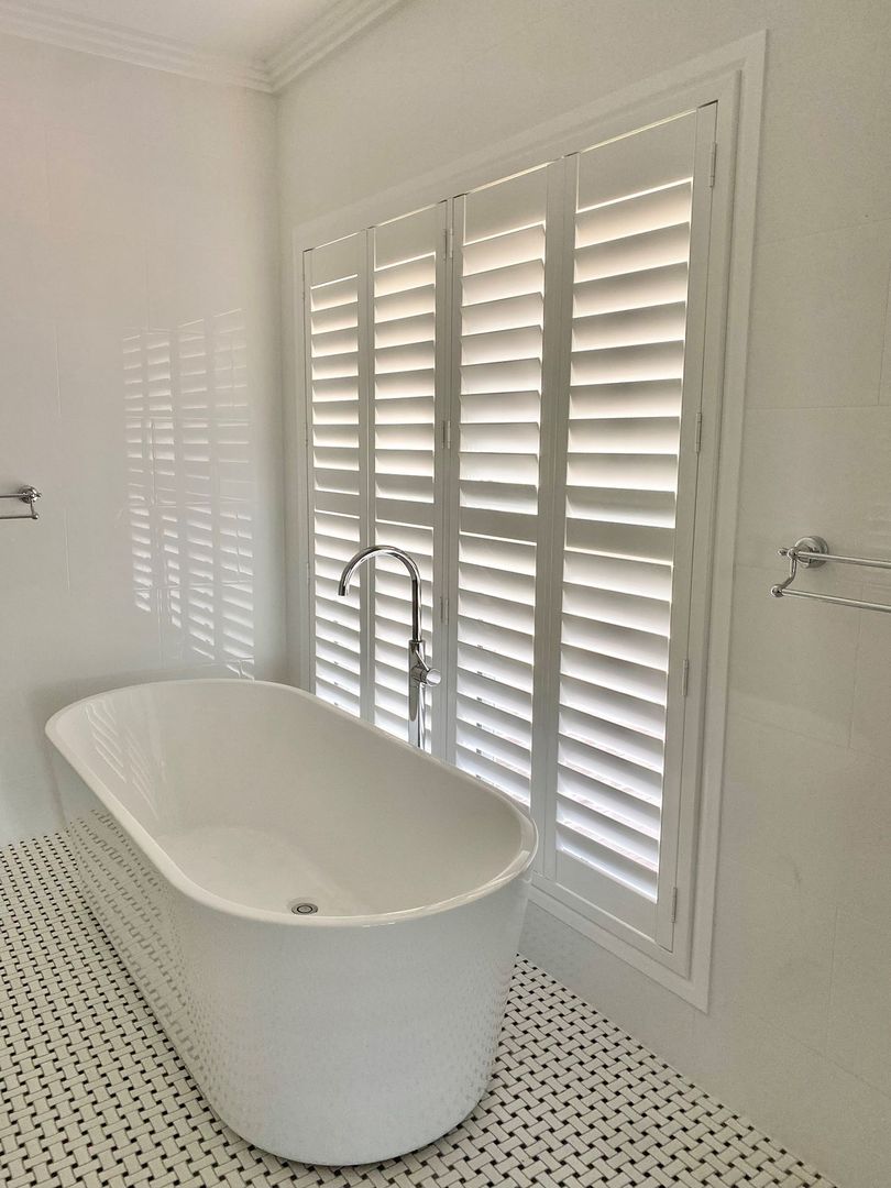 white shutters in a bathroom