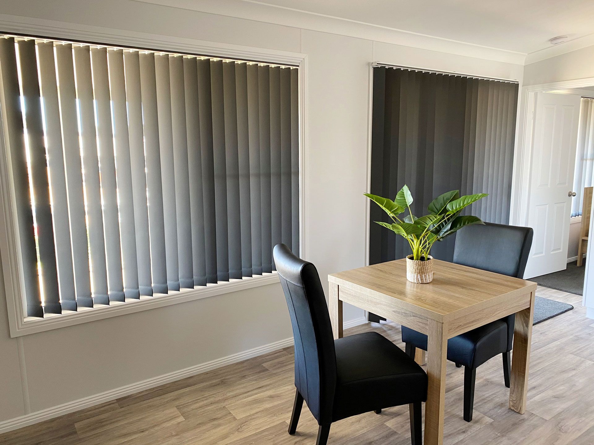 Charcoal vertical drapes in a home