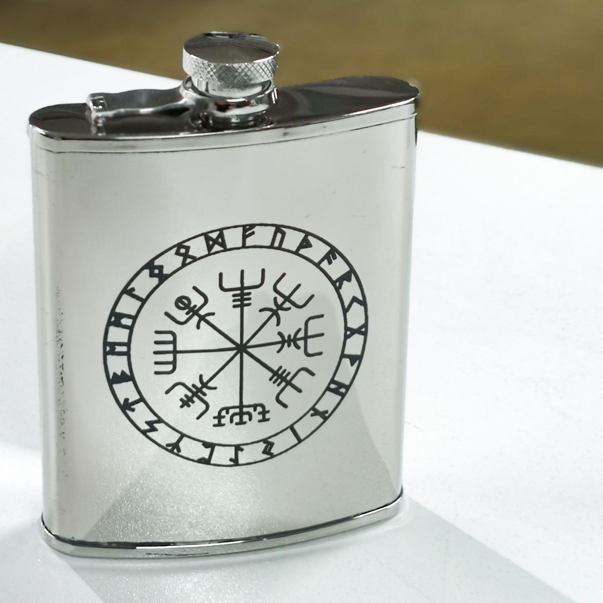 A Silver Flask With a Compass and Runes on it — NMTG Engraving in Wollongong, NSW