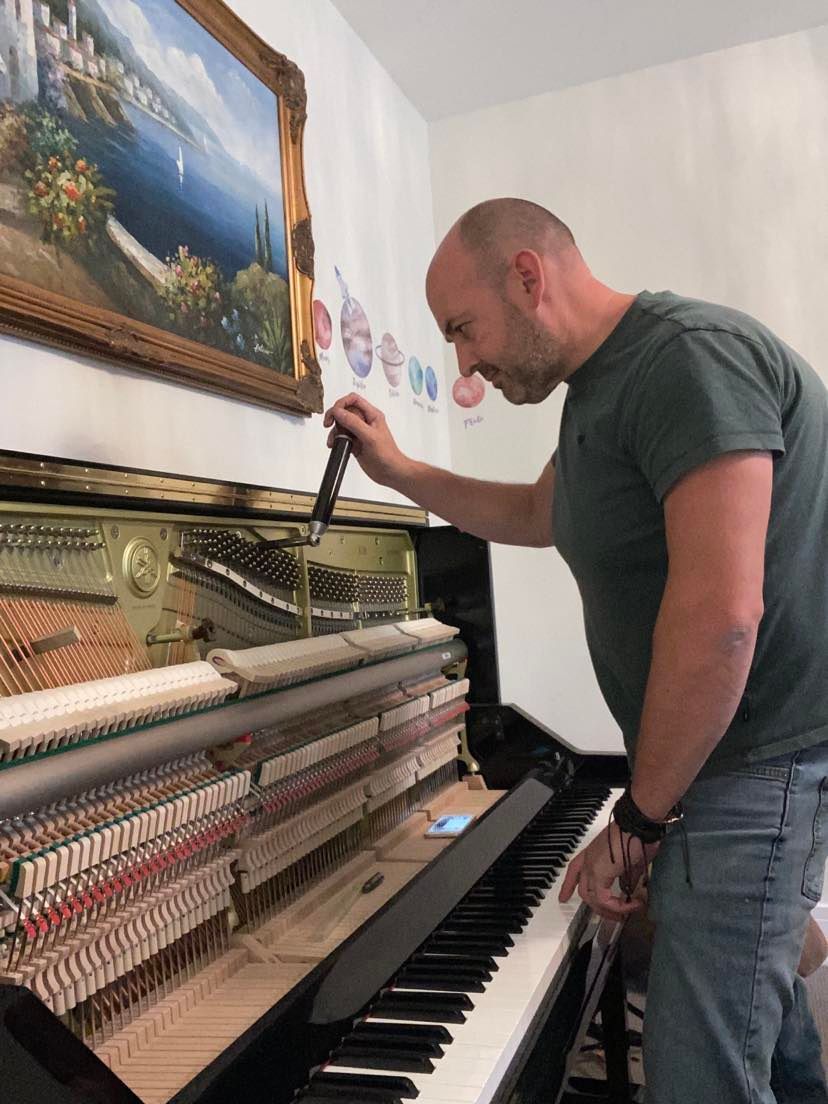 tuning a piano in Ewhurst