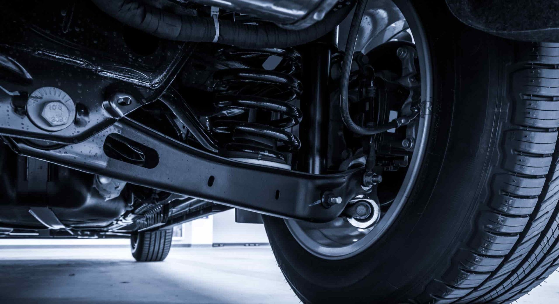 a Close Up of the Underside of a Car With a Tire — Wayne Boylett Mechanical In Bungalow, QLD