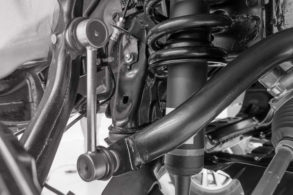a Black and White Photo of a Car Suspension System  — Wayne Boylett Mechanical In Bungalow, QLD