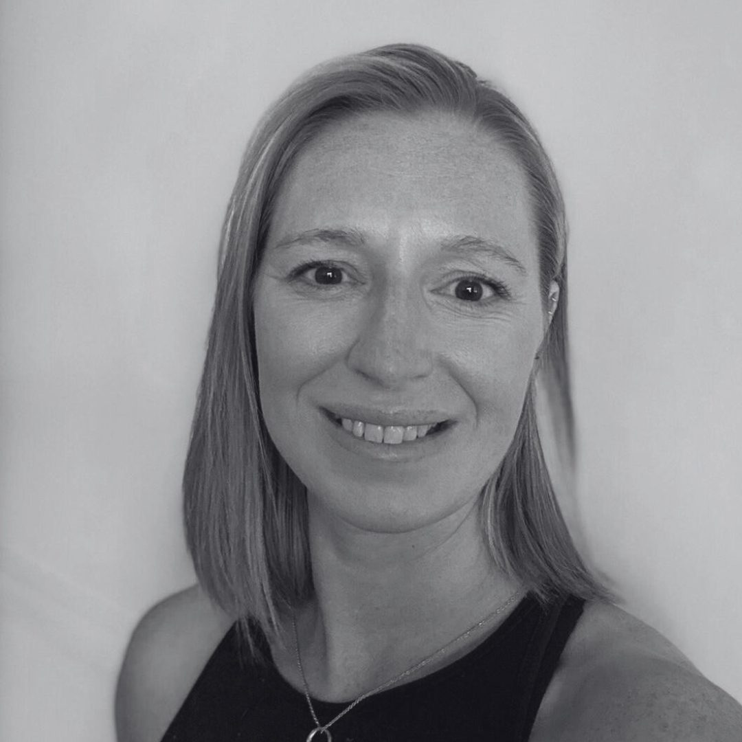 Black and white headshot of Kate, reformer Pilates instructor at Amilia Studios