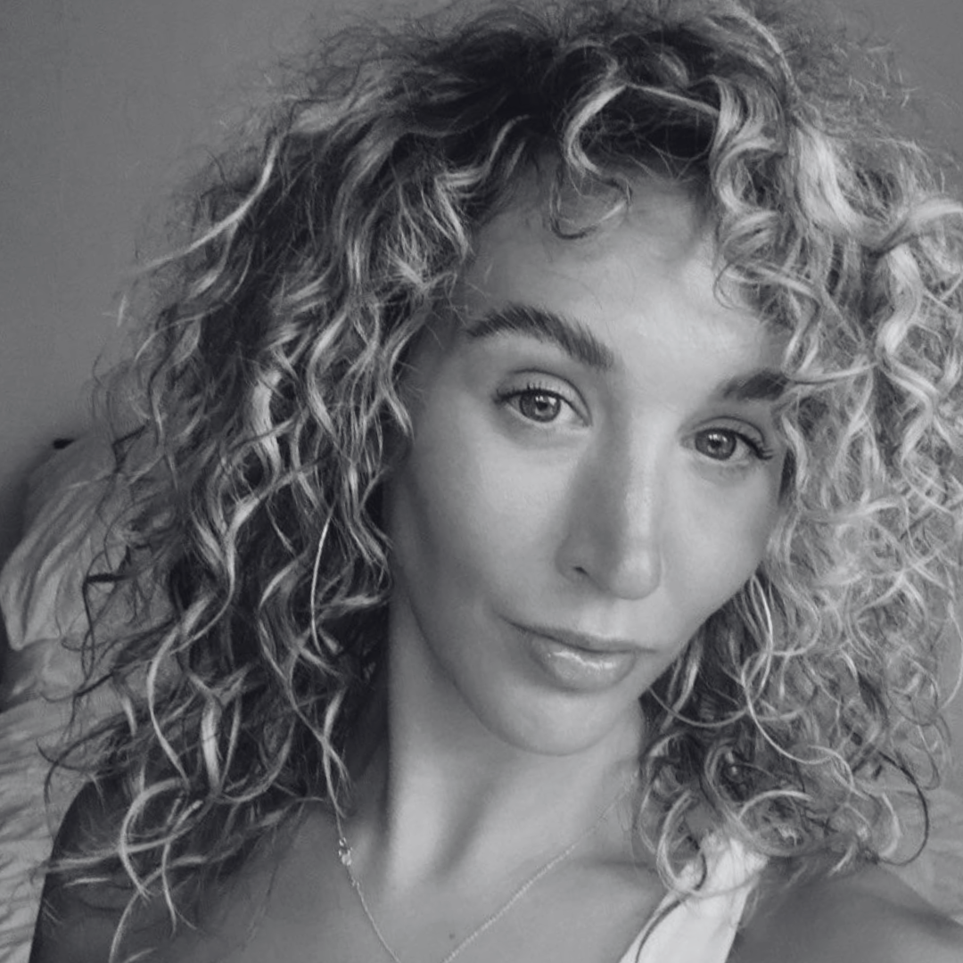 Black and white headshot of Kat, reformer Pilates instructor at Amilia Studios