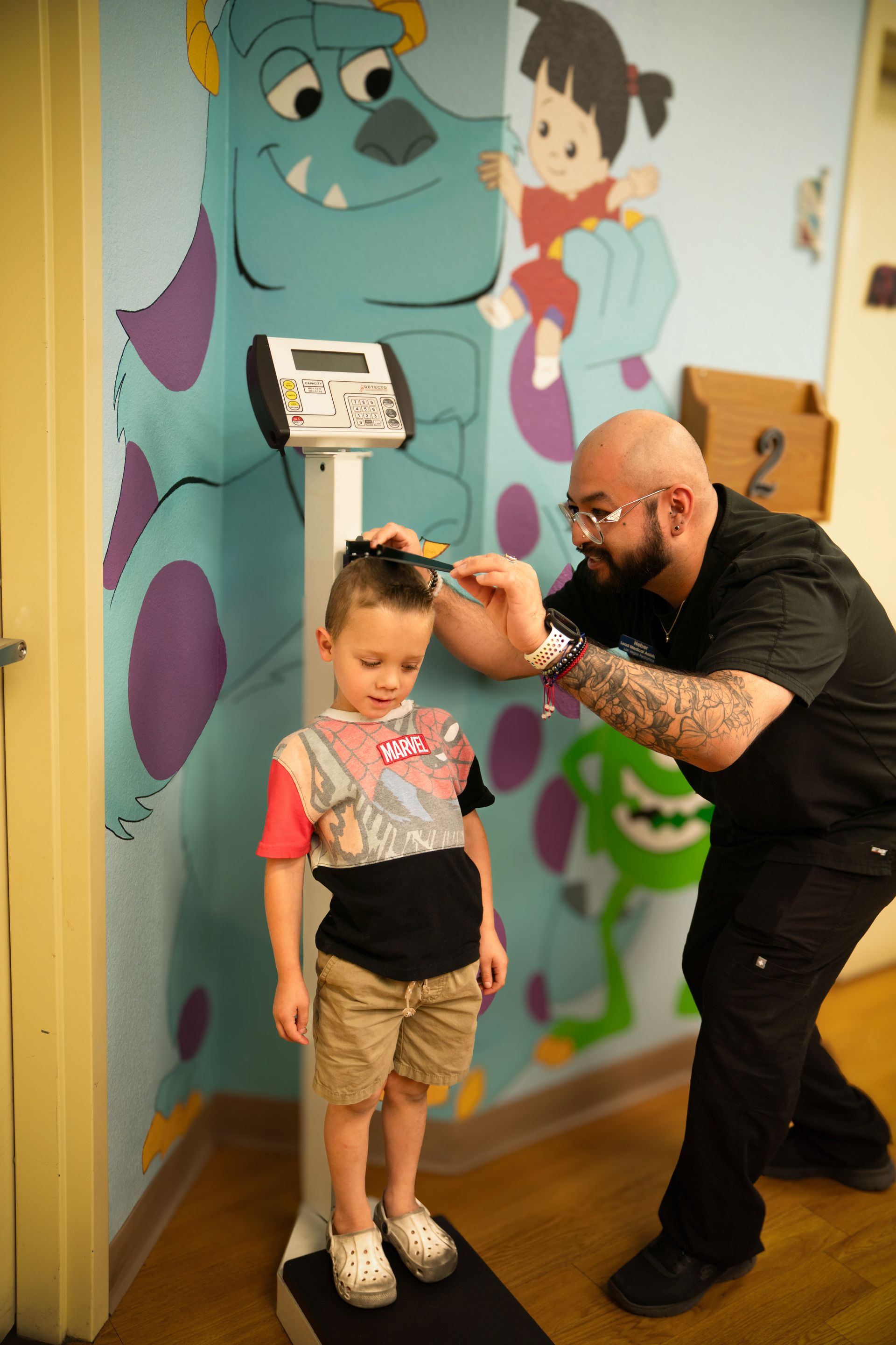 A girl is receiving a vaccination from a pediatrician