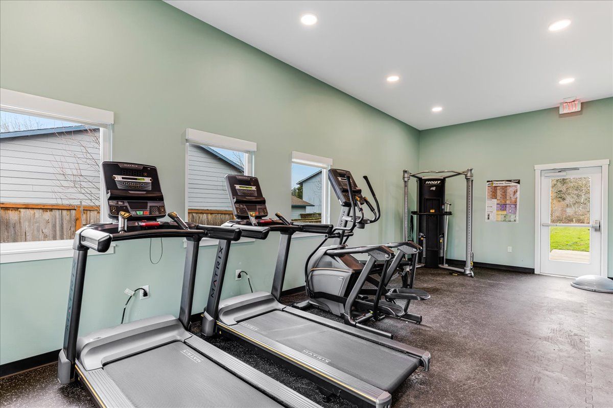 a gym with treadmills , ellipticals , and other exercise equipment .