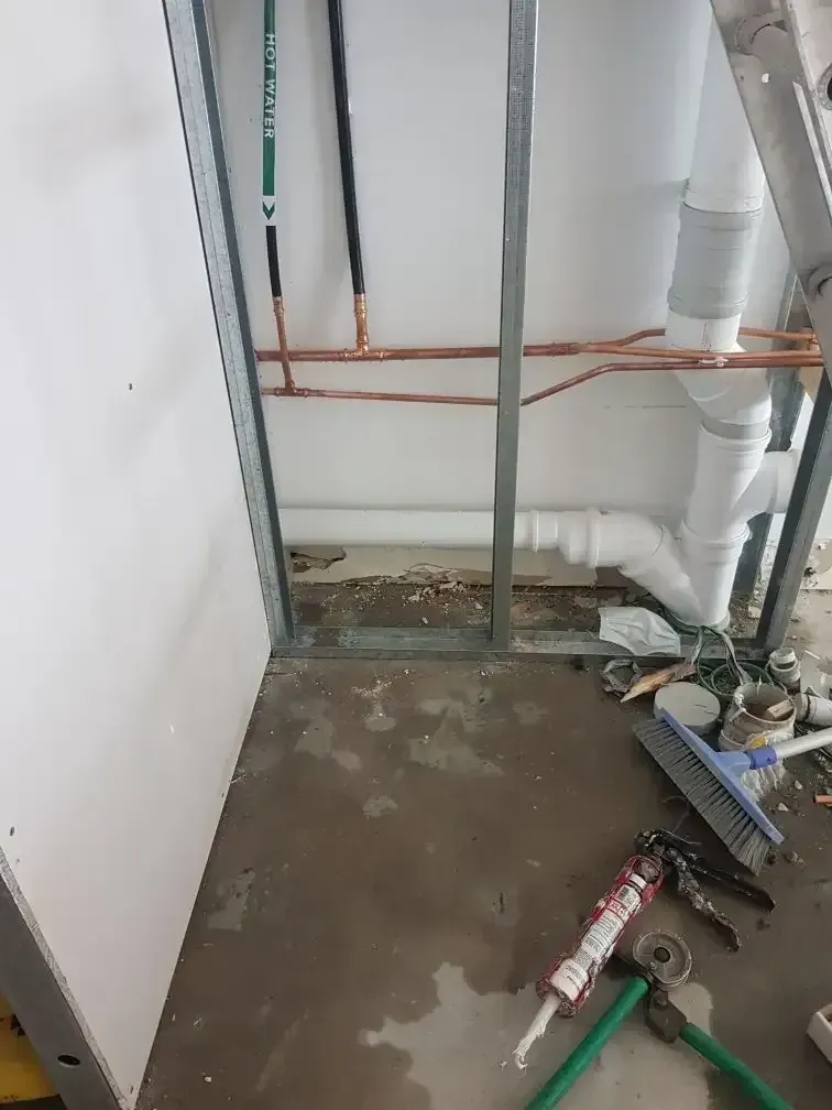 A Room With a Lot of Pipes and Tools on the Floor — Pimlico Plumbing in Mount Louisa, QLD