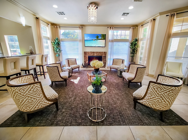 A living room filled with furniture and a fireplace at Steeplechase Apartments.in Knoxville, Tennessee