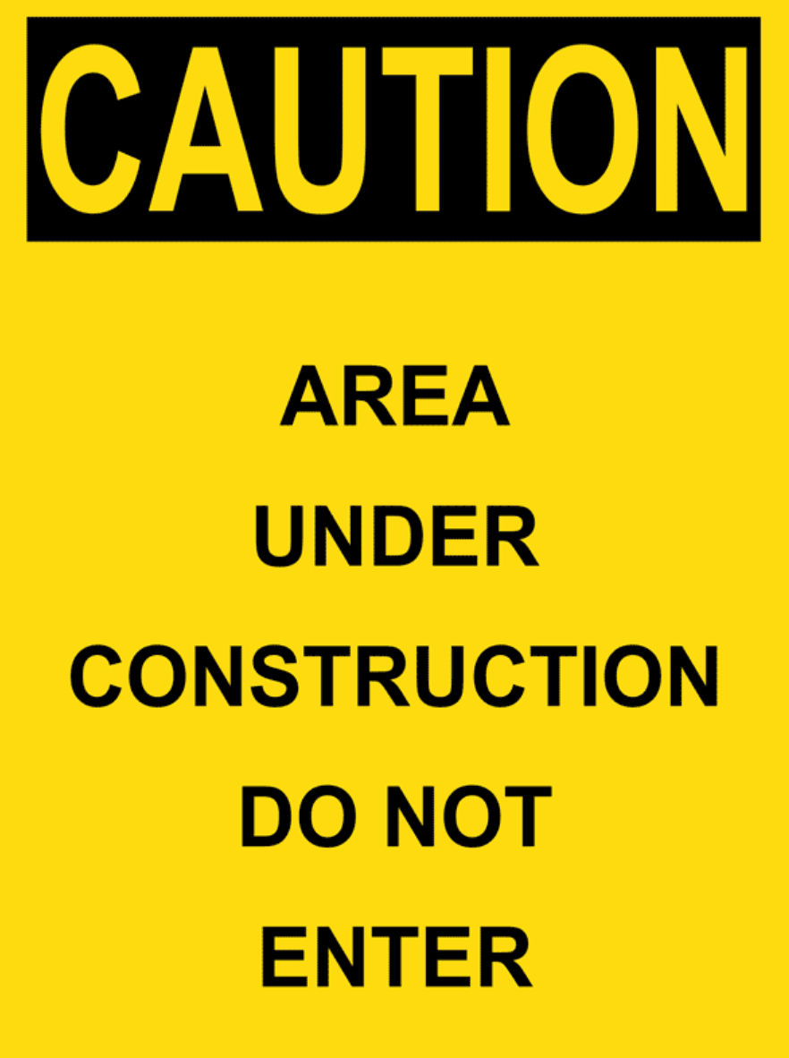 Yellow caution sign reading “AREA UNDER CONSTRUCTION DO NOT ENTER.”