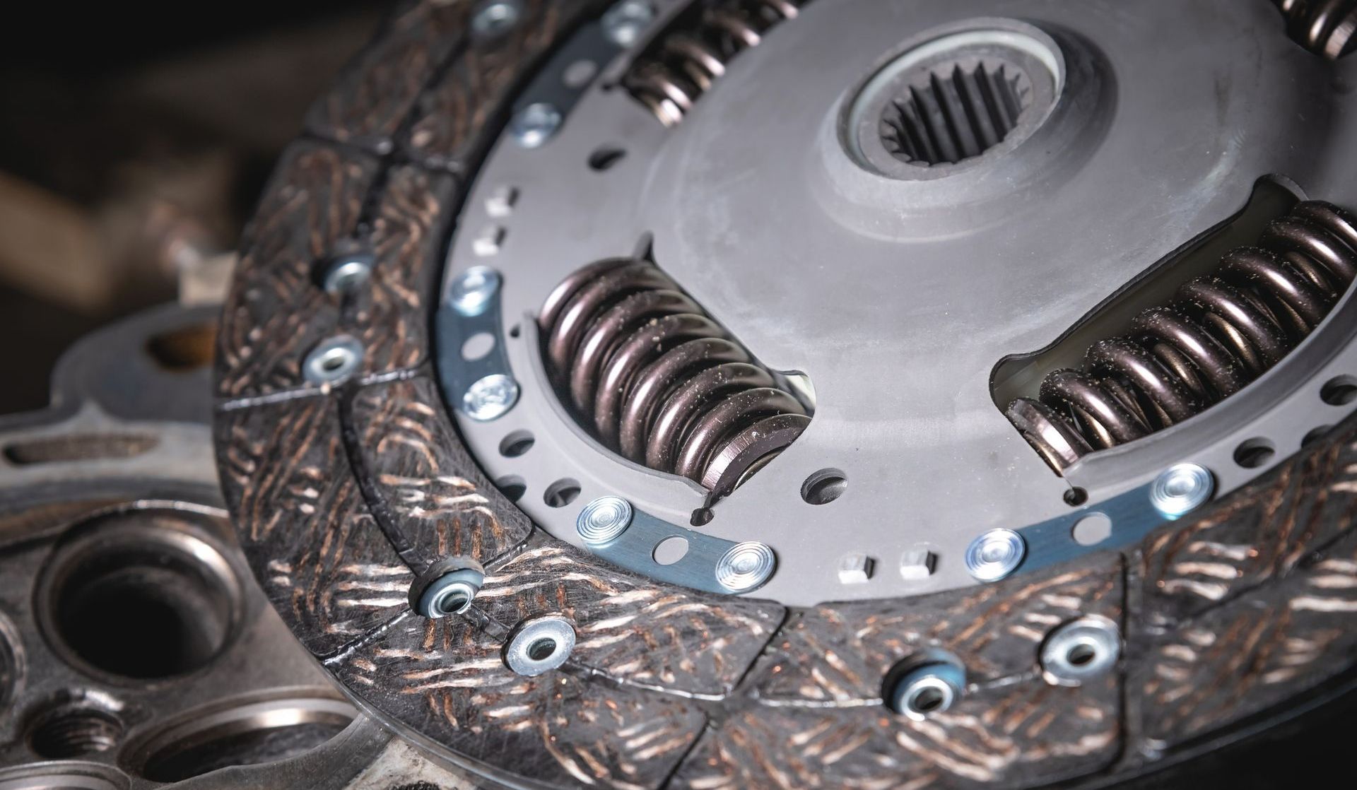 A close up of a clutch disc with springs on it.