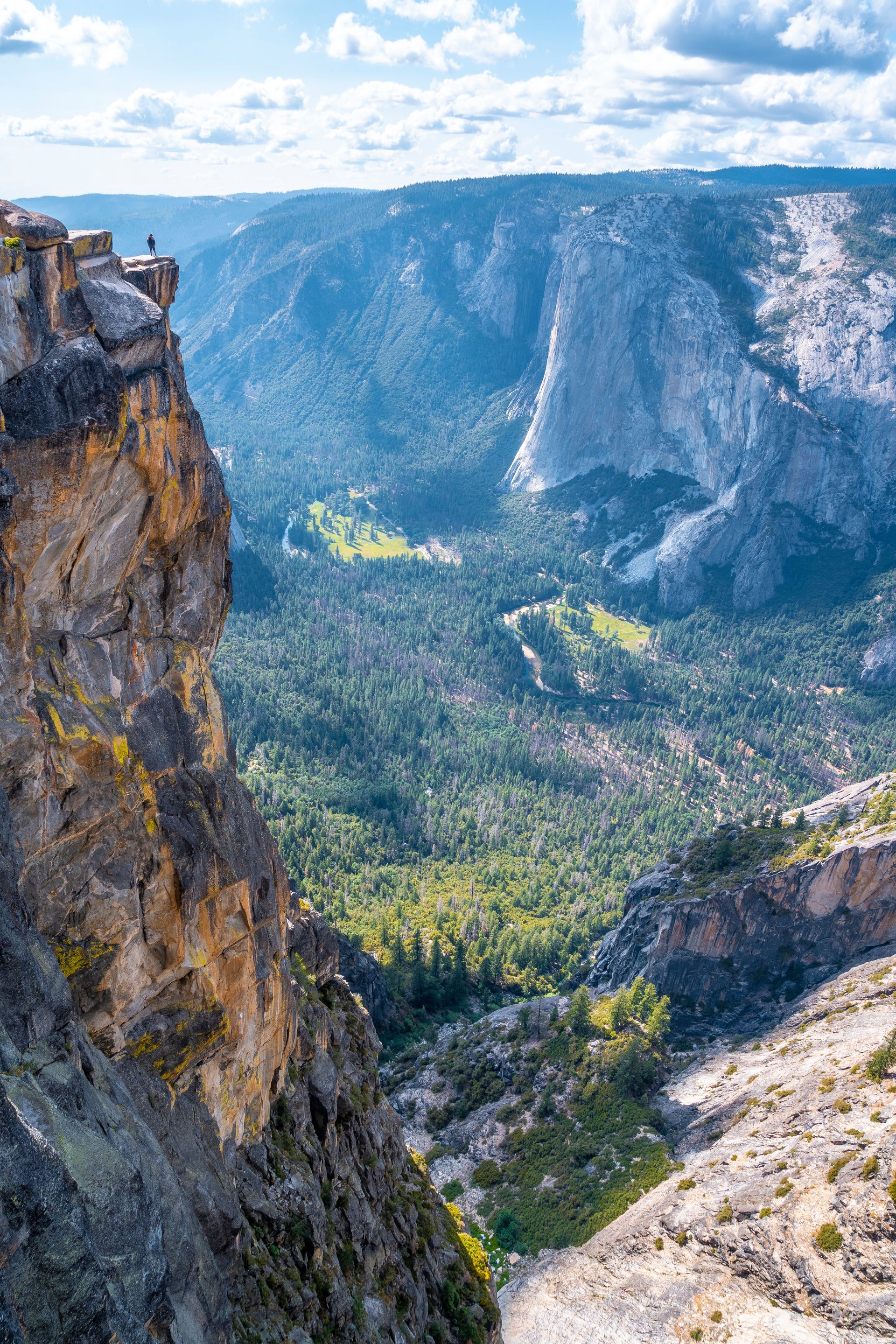 A view of a valley from the top of a mountain.