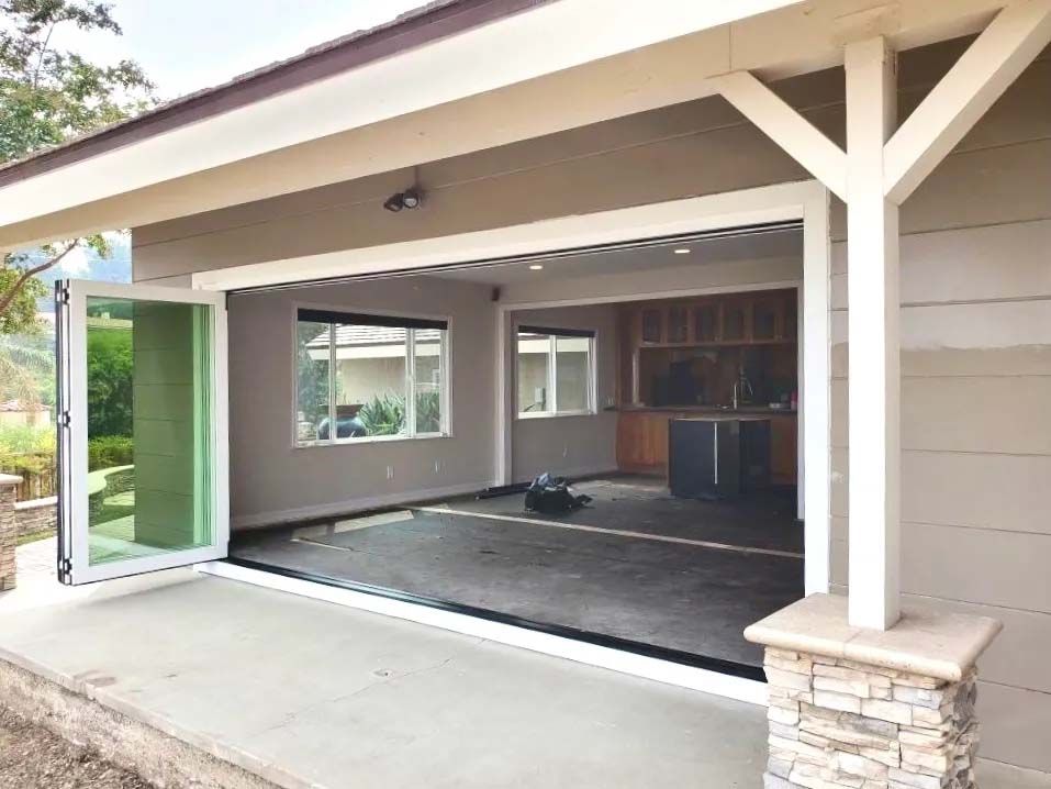A garage with a lot of windows and doors open