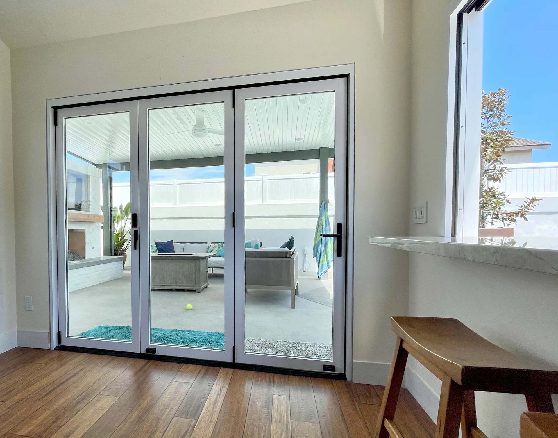 A room with sliding glass doors leading to a patio.