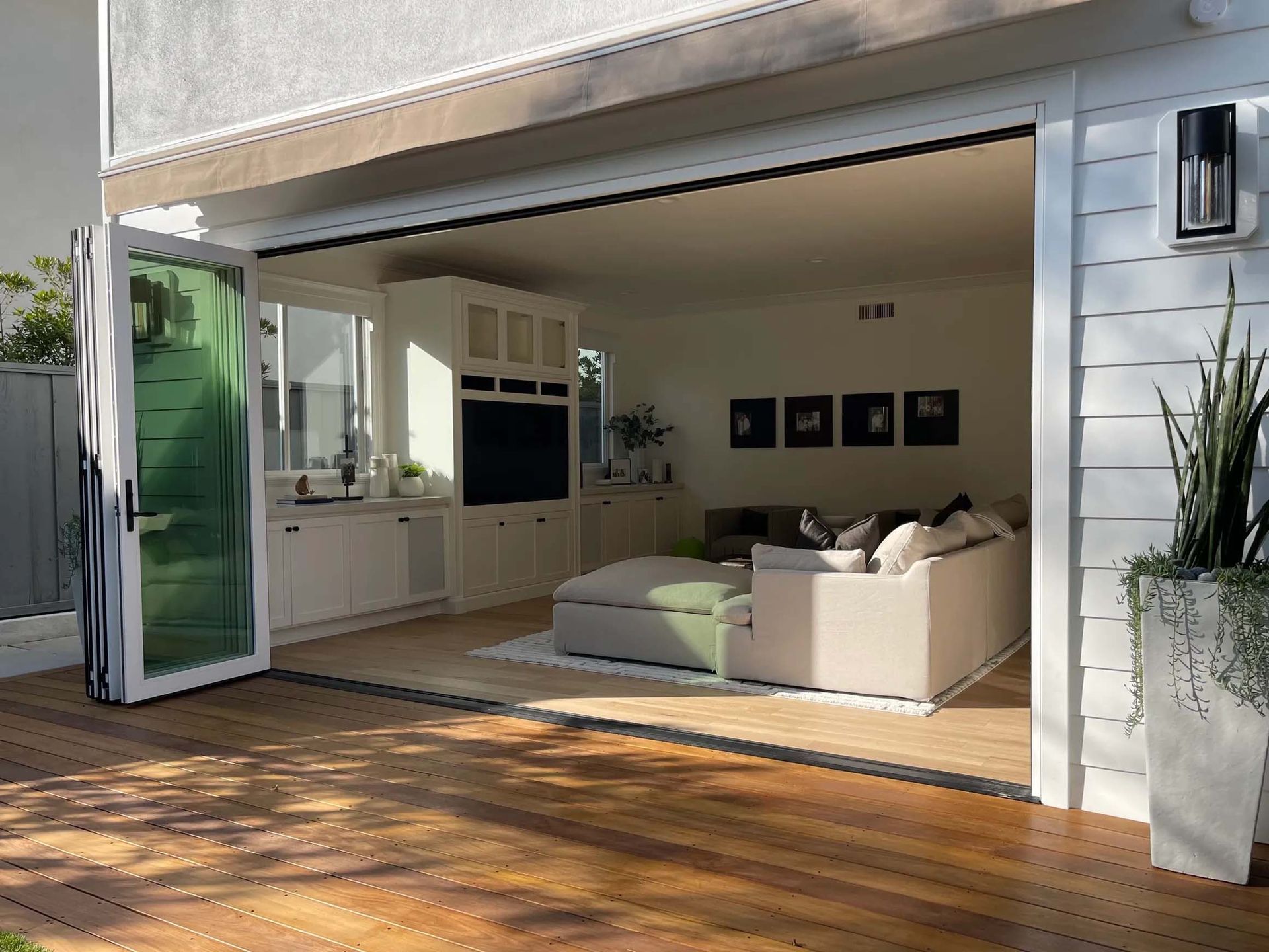 A living room with a couch and a flat screen tv