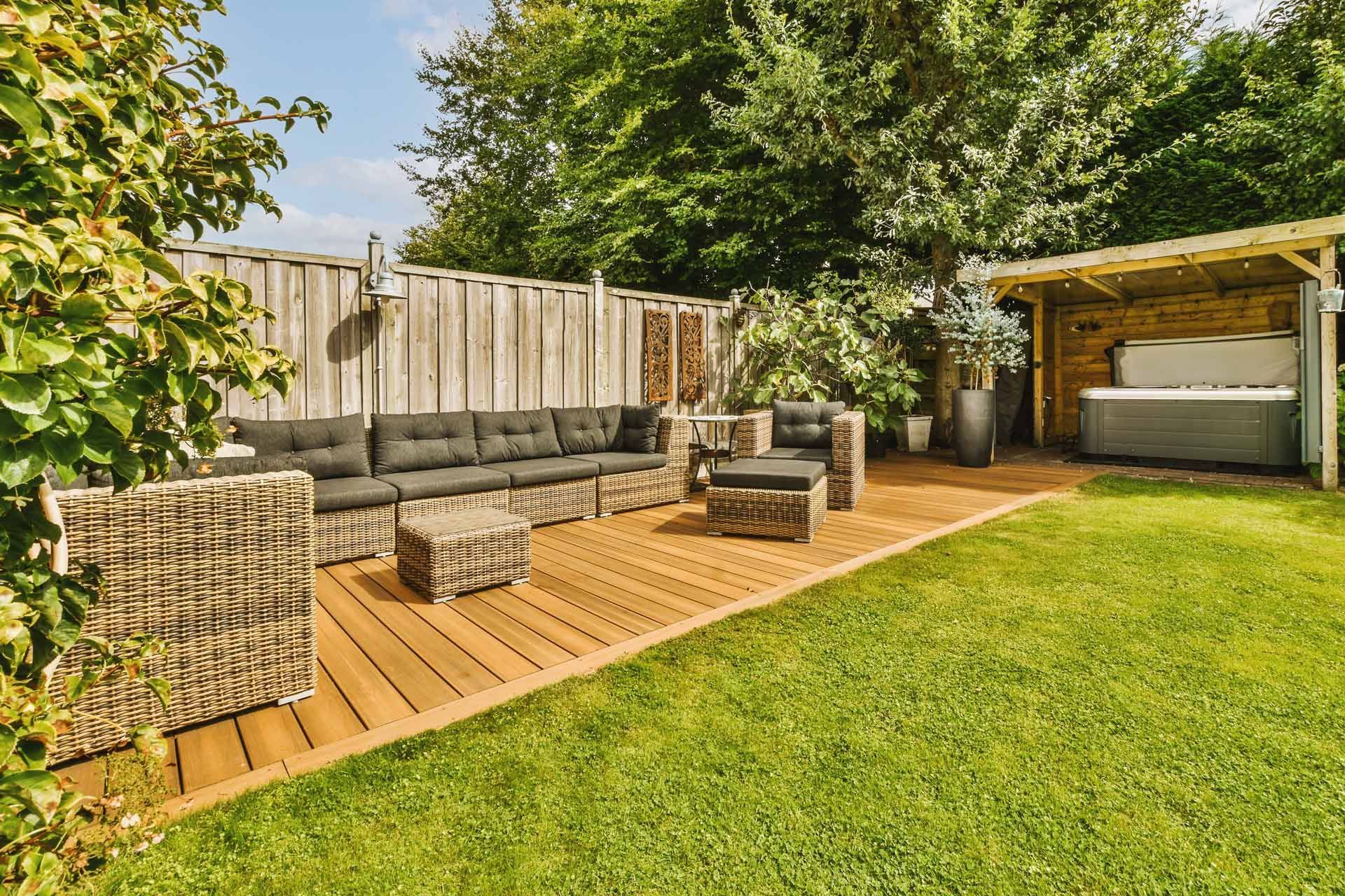 A backyard with a wooden deck