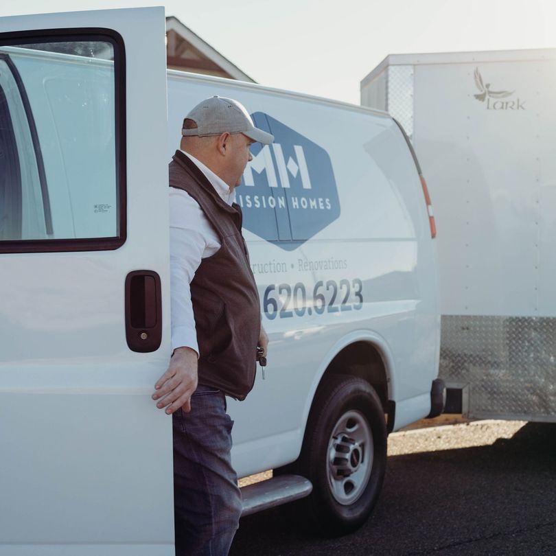 Man exits a white van with