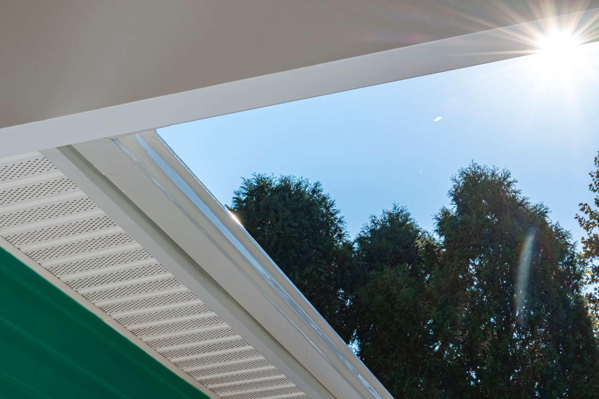 The sun is shining through the roof of a house