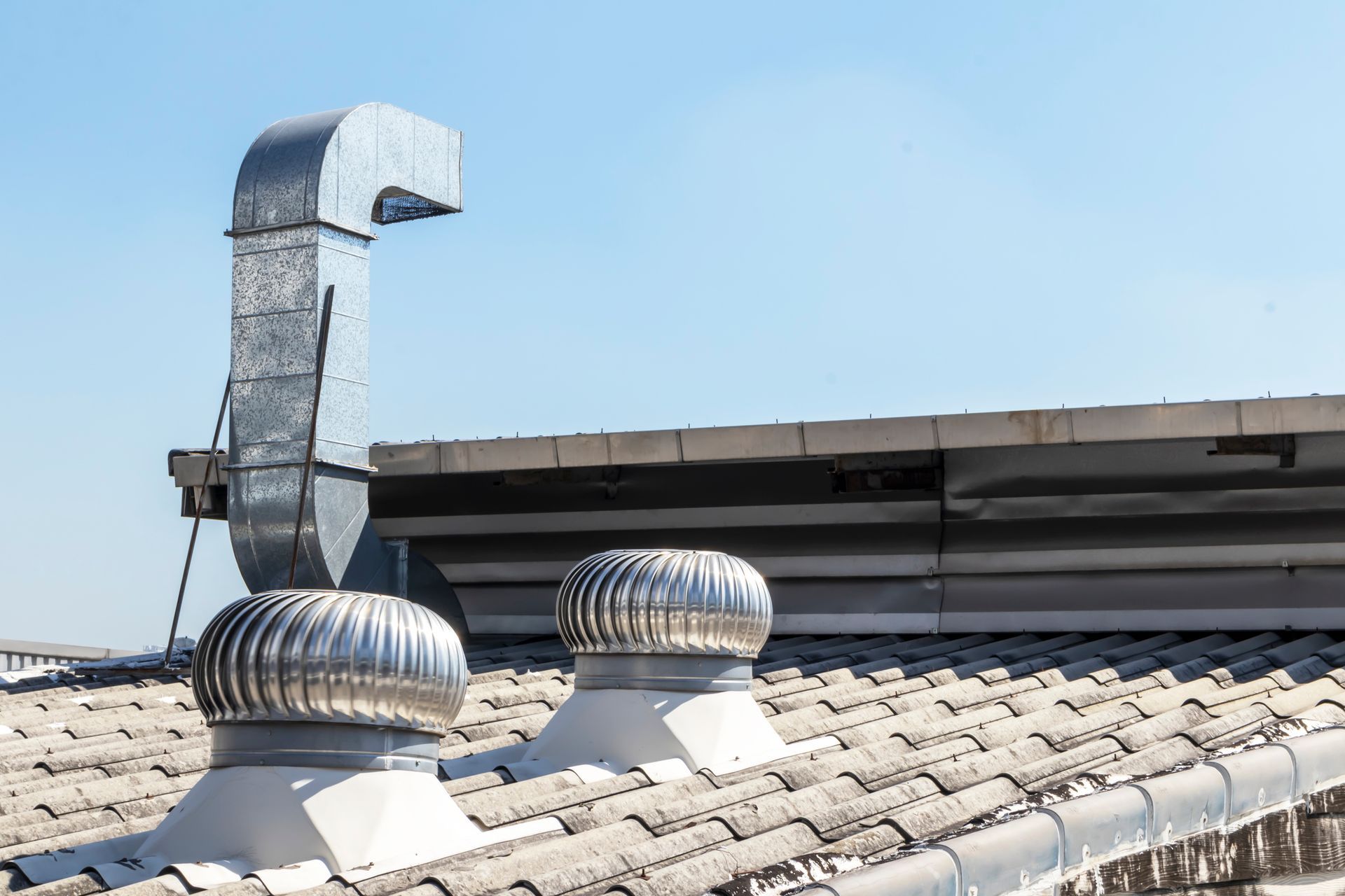 A roof with a ventilation system on it.
