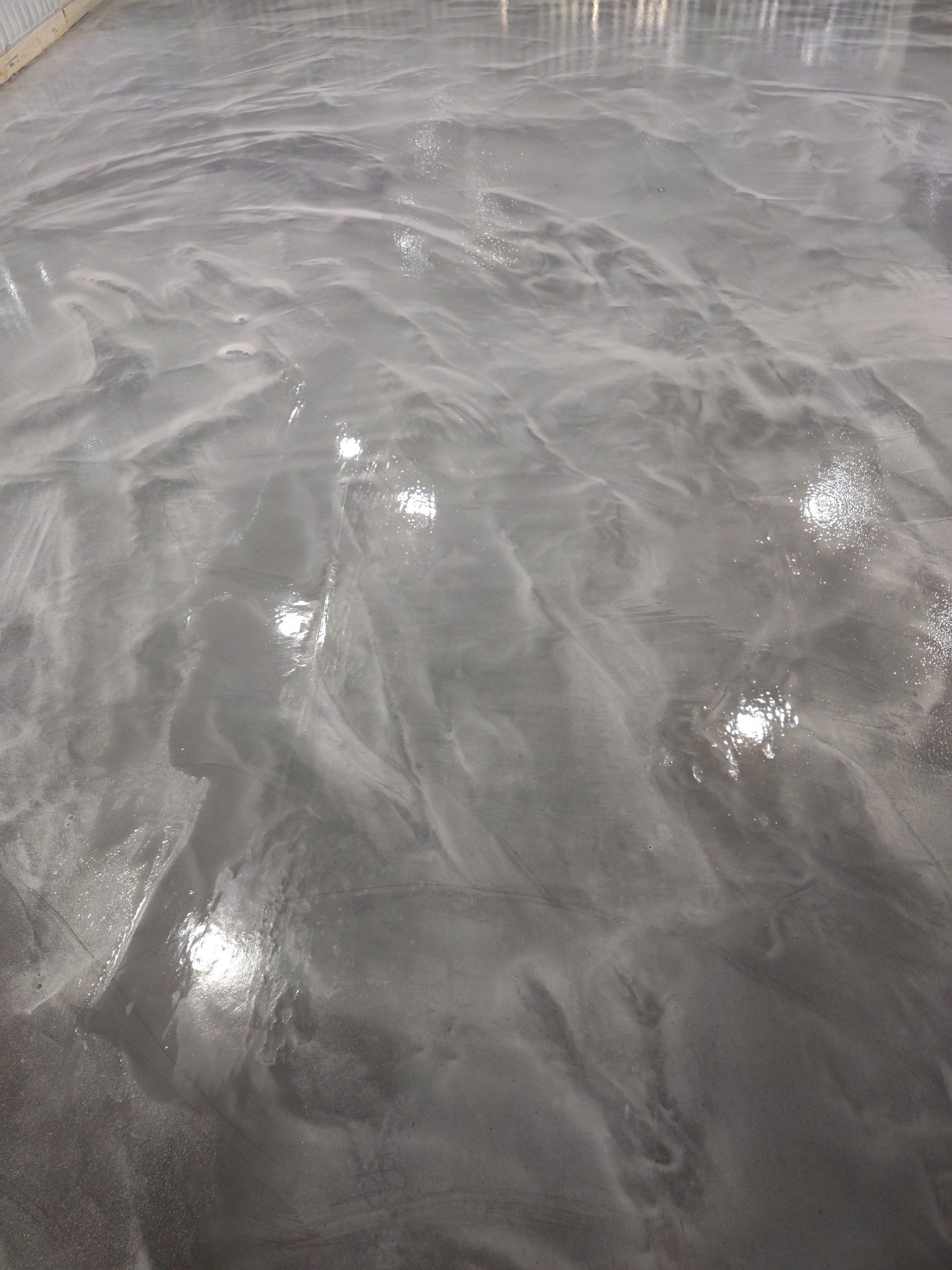 Shimmering gray water with bright reflections and rippling waves