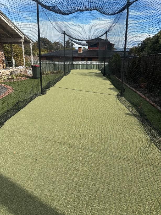 A Cricket Net Is Covering A Cricket Field In A Backyard — Tiger Concrete ACT In Fadden, ACT