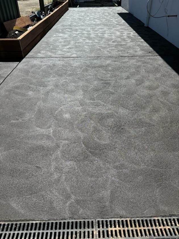 A Concrete Driveway With A Drain On The Side Of It — Tiger Concrete ACT In Fadden, ACT