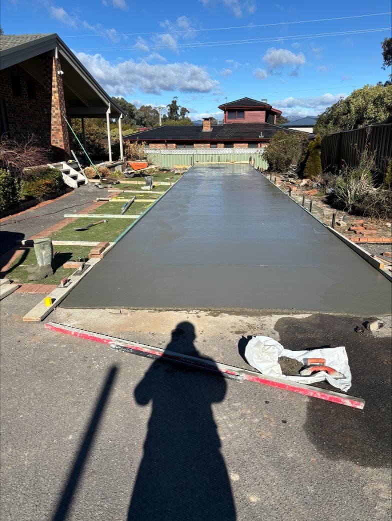 A Concrete Driveway Is Being Built In Front Of A House — Tiger Concrete ACT In Fadden, ACT