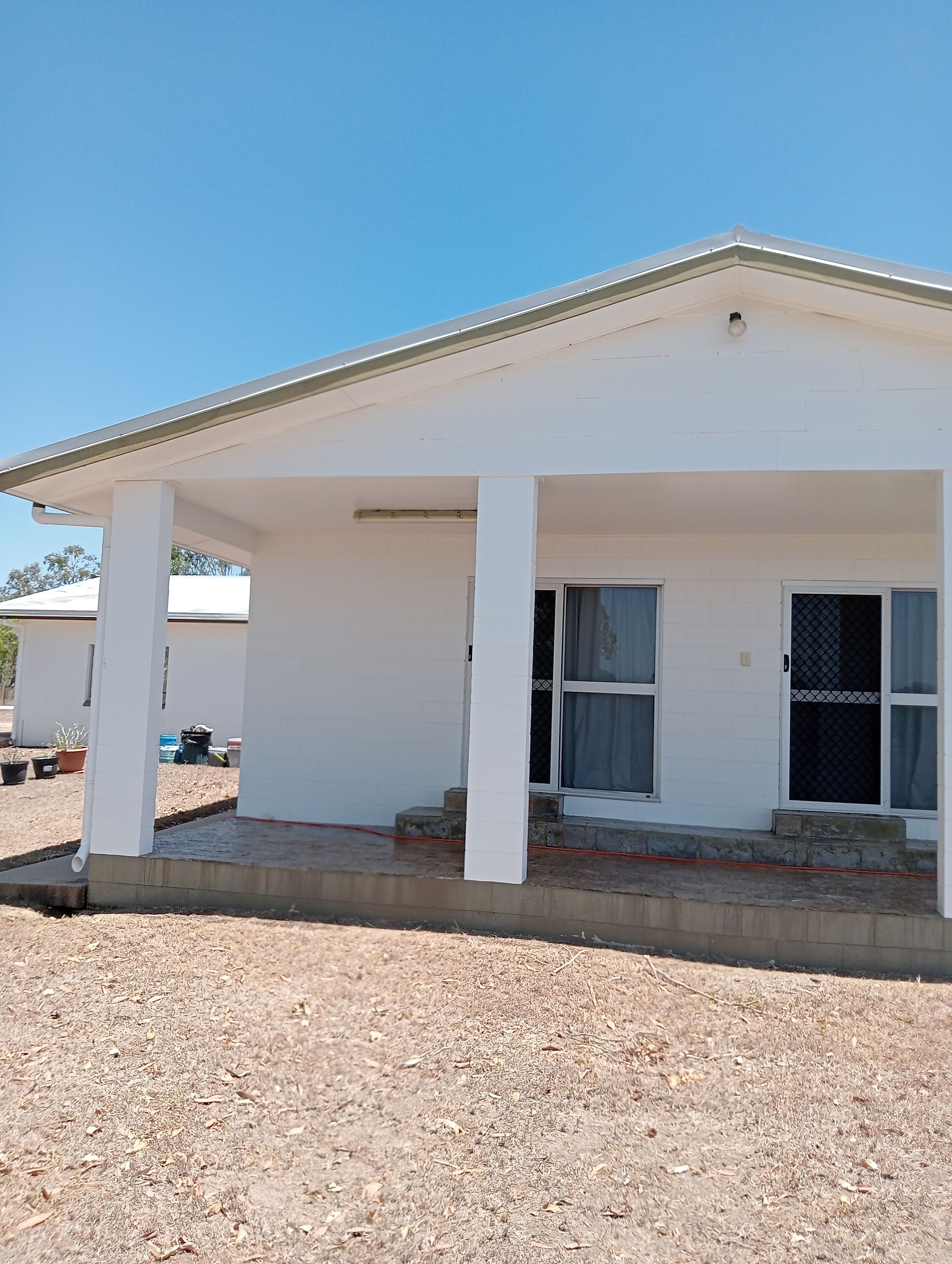 White Building With Columns, Covered Porch — All Sparkles Cleaning Technology In Bowen, QLD