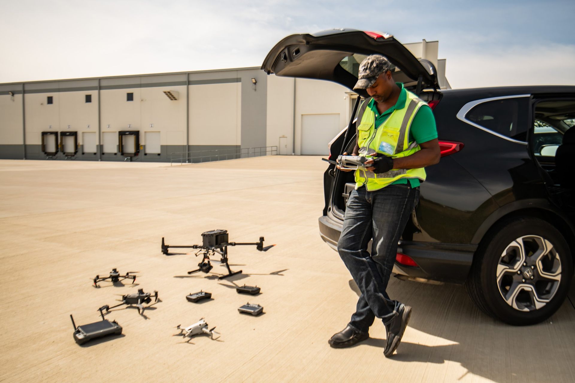 ARO Aerial pilot setting up DJI Matrice drones and payloads on a job site