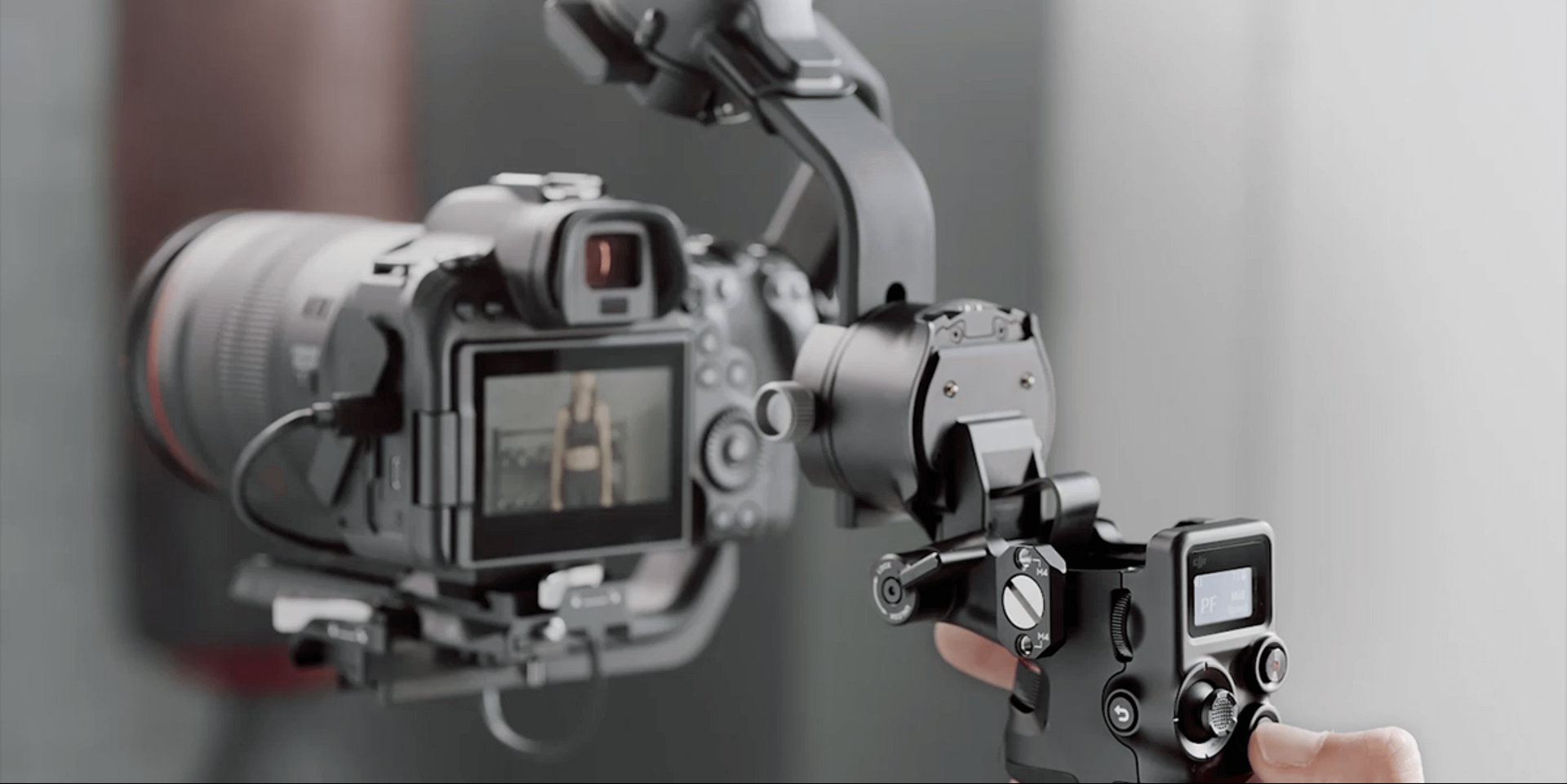 A videographer behind a camera in a studio, with the text: 
