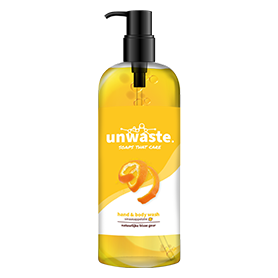 Een fles ongebruikte hand- en lichaamszeep met een sinaasappelschil op het etiket.