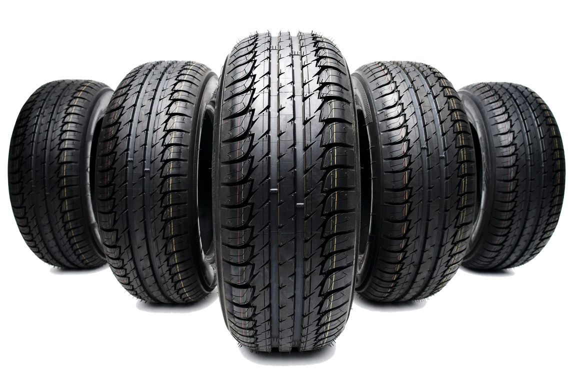 A group of tires are lined up in a row on a white background.