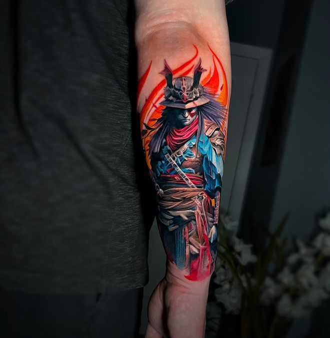 A man has a colorful tattoo of a samurai on his forearm.