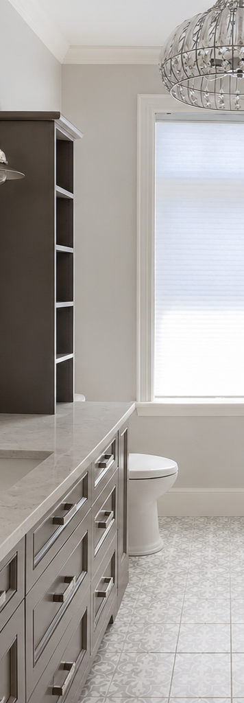 Modern bathroom with gray vanity, white tiled floor, window blinds, and ornate chandelier.