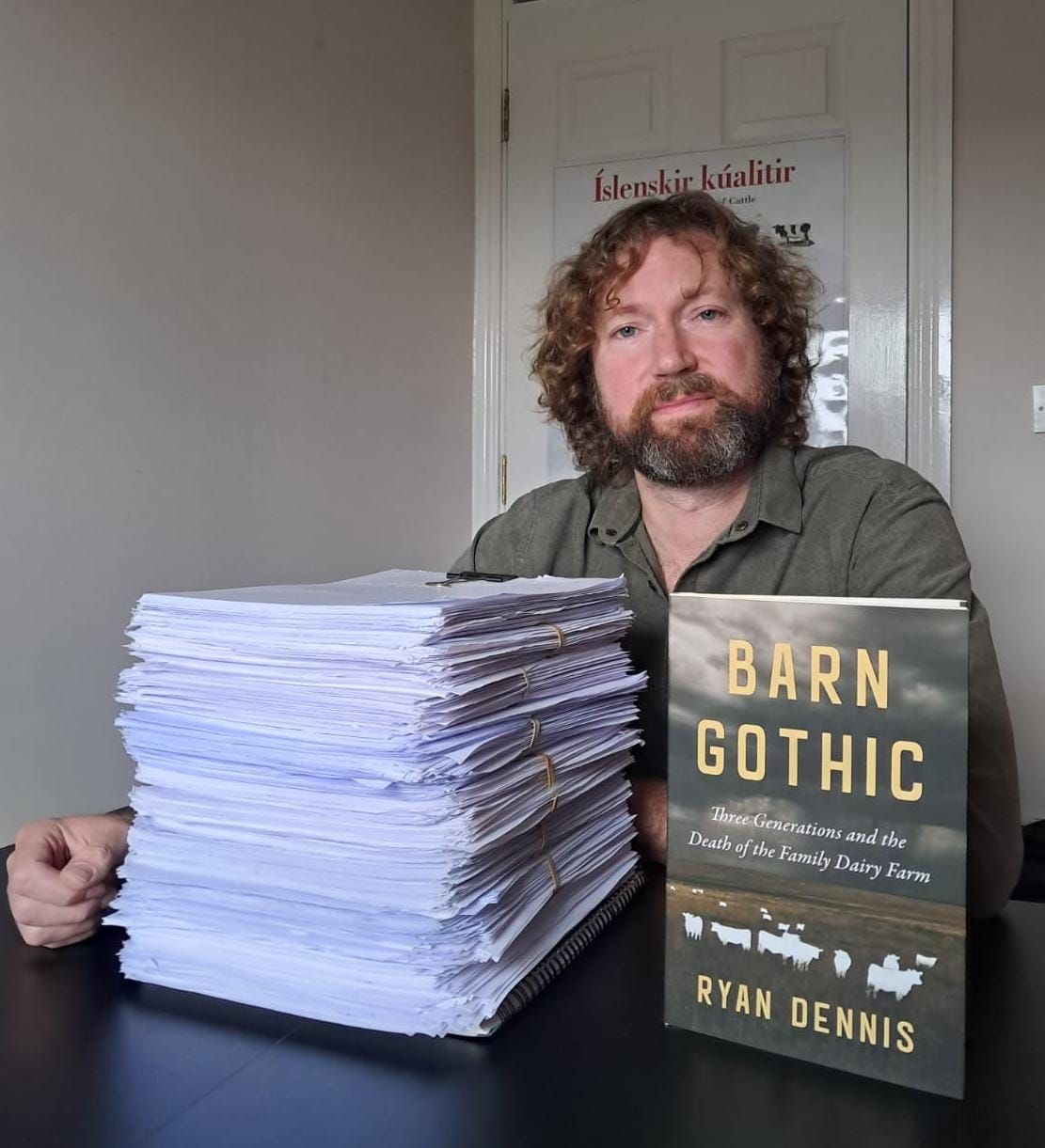Ryan Dennis with manuscript and final copy of 