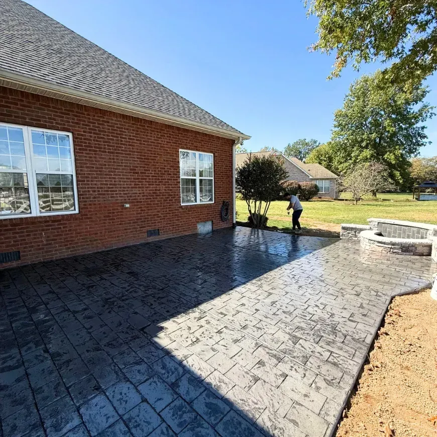A brick house with a patio in front of it