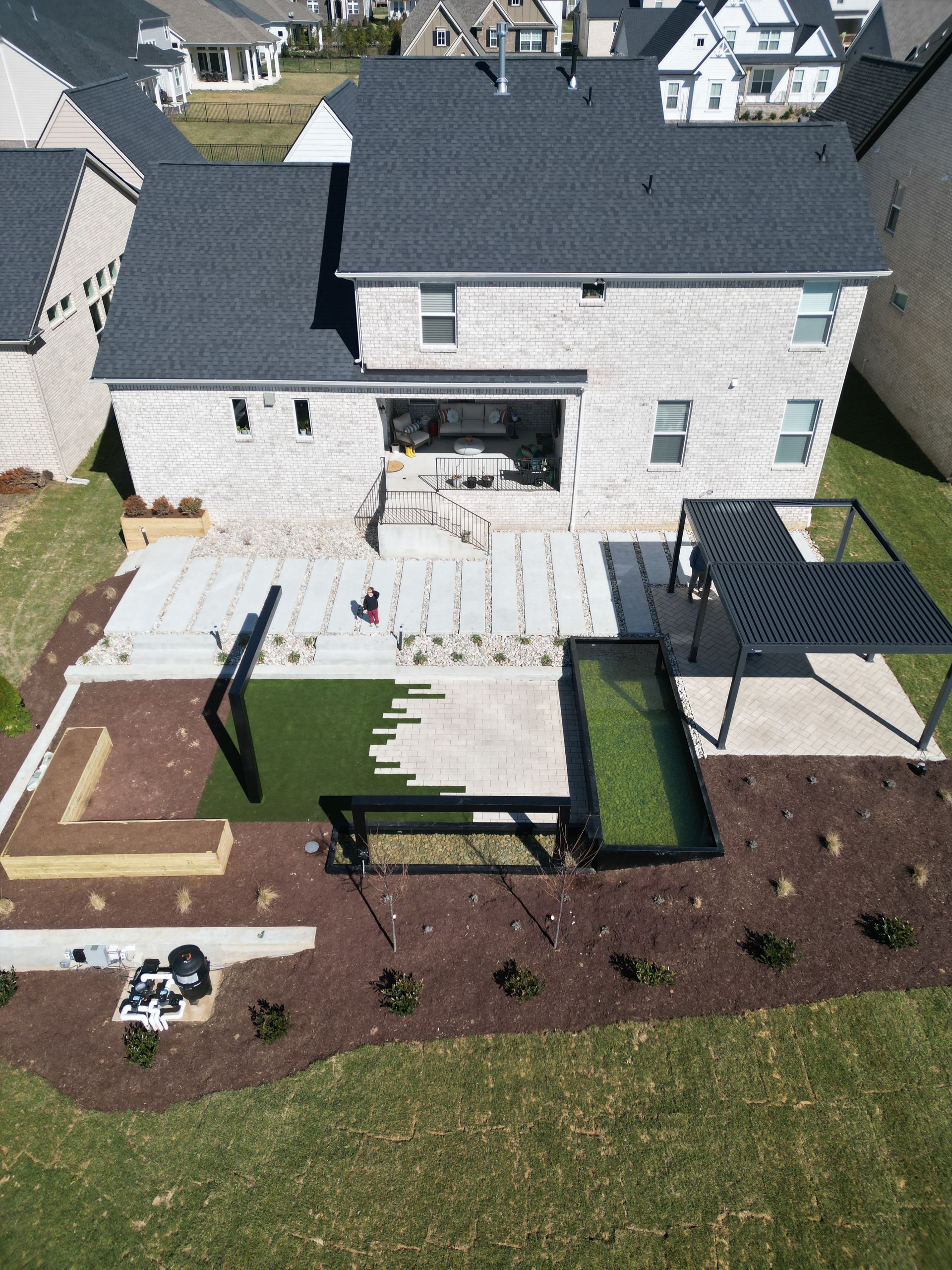 An aerial view of the backyard of a house