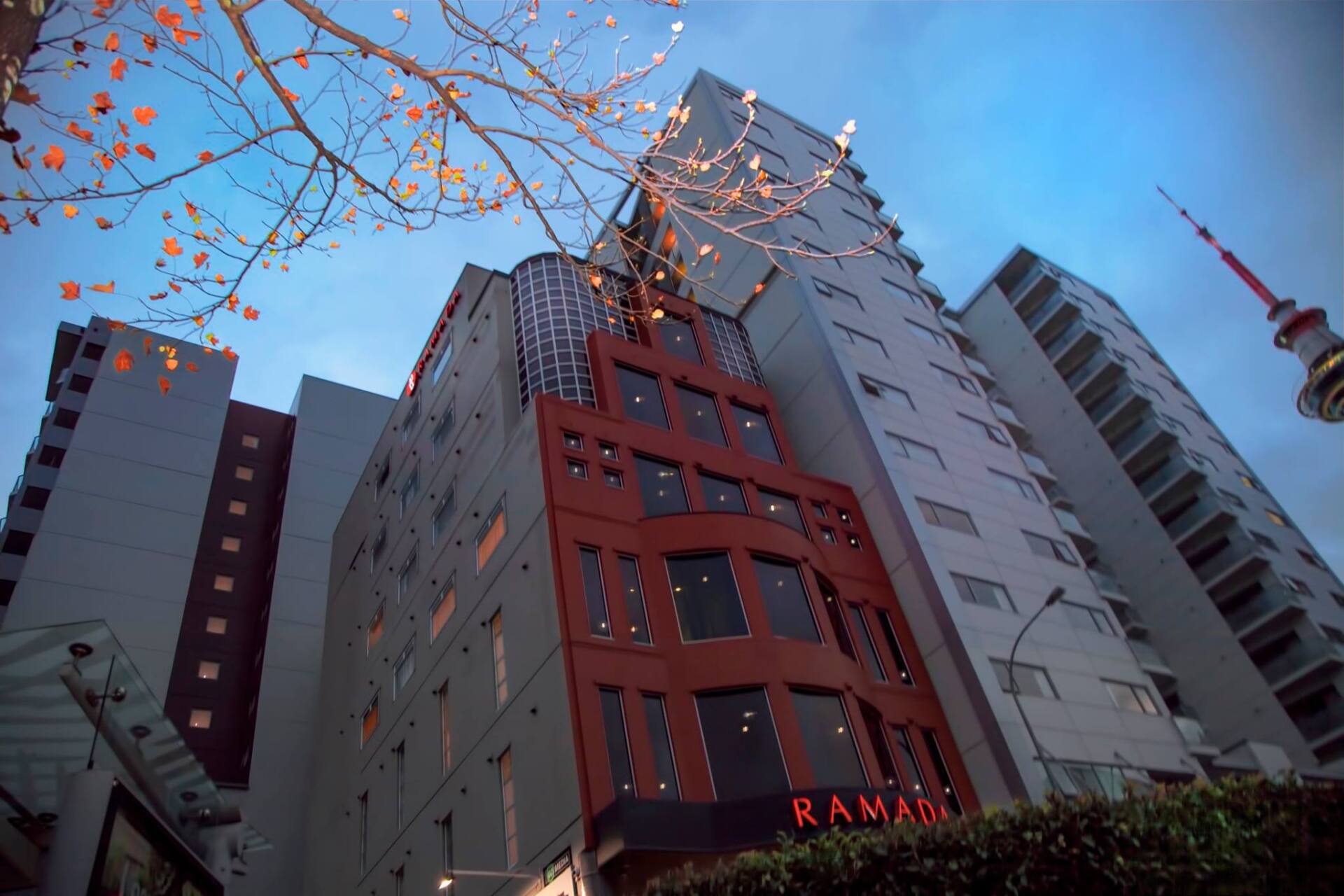 Looking up at a building with the word ramada on it