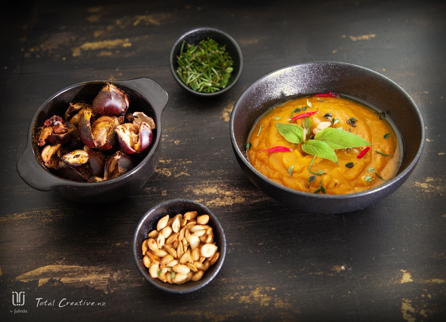 Pumpkin soup food photography from Total Creative with chestnuts rosemary and pumpkin seed garnishing
