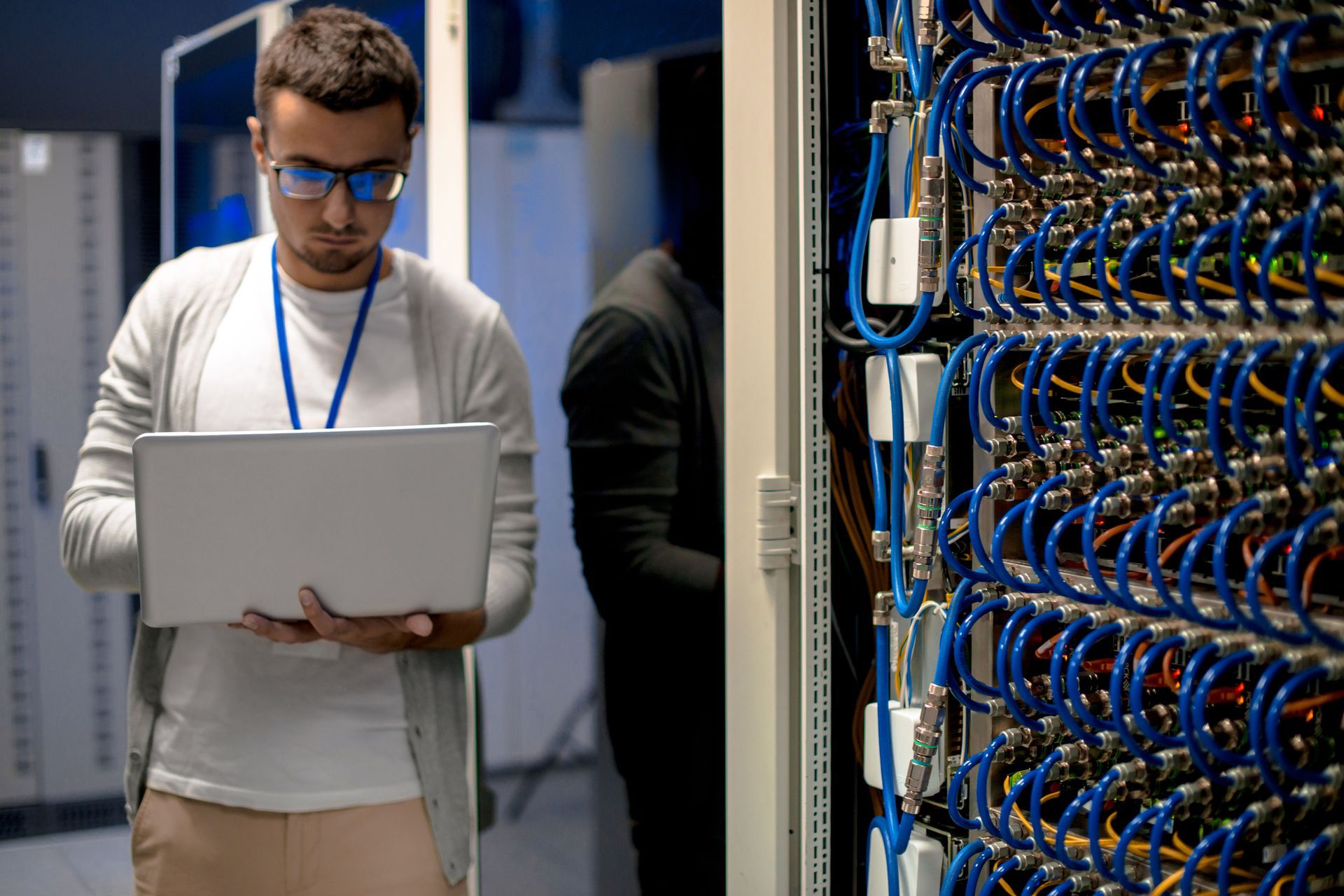 Houston IT technician performing server maintenance during a managed services or network assessment.