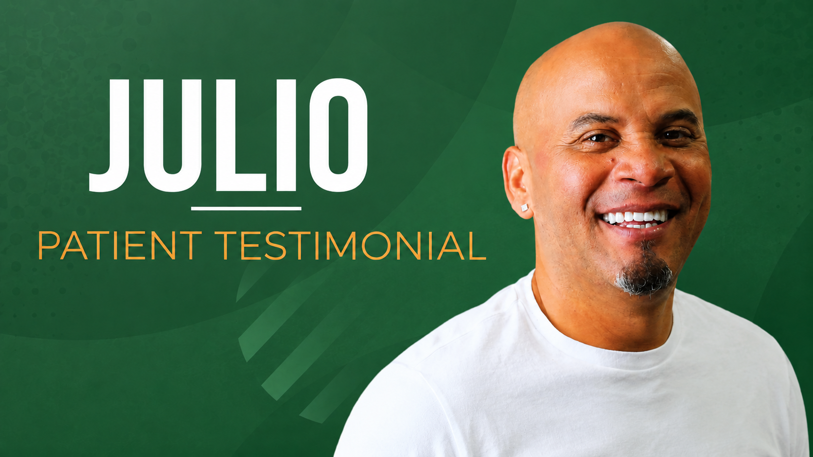 Bald Hispanic man with a goatee smiling