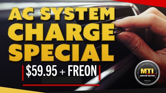 AC system charge special for $59.95, plus Freon. Hand holding a tool near a car.