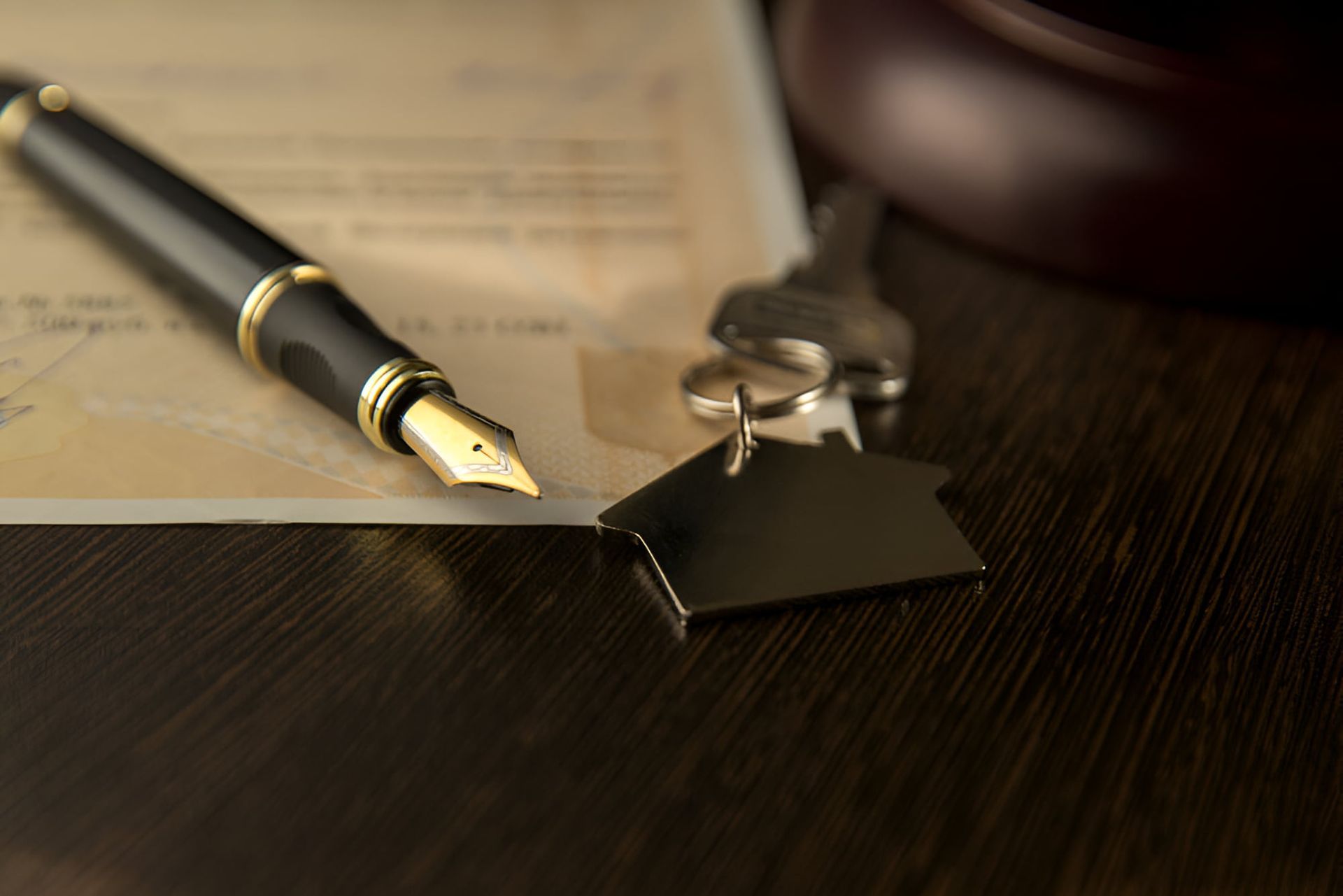 A Fountain Pen Is Sitting On Top Of A Piece Of Paper Next To A House Key — De Silva Hebron In Darwin City, NT