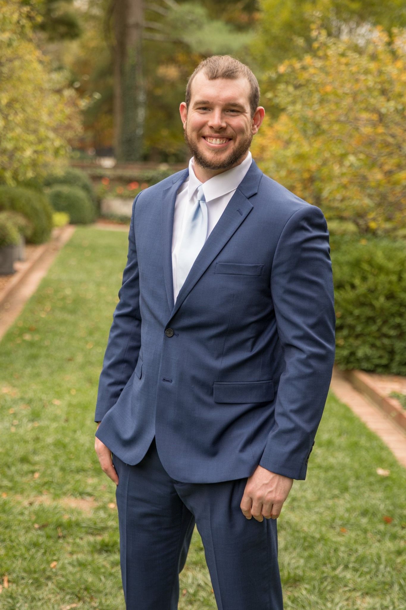 Owner in a suit.