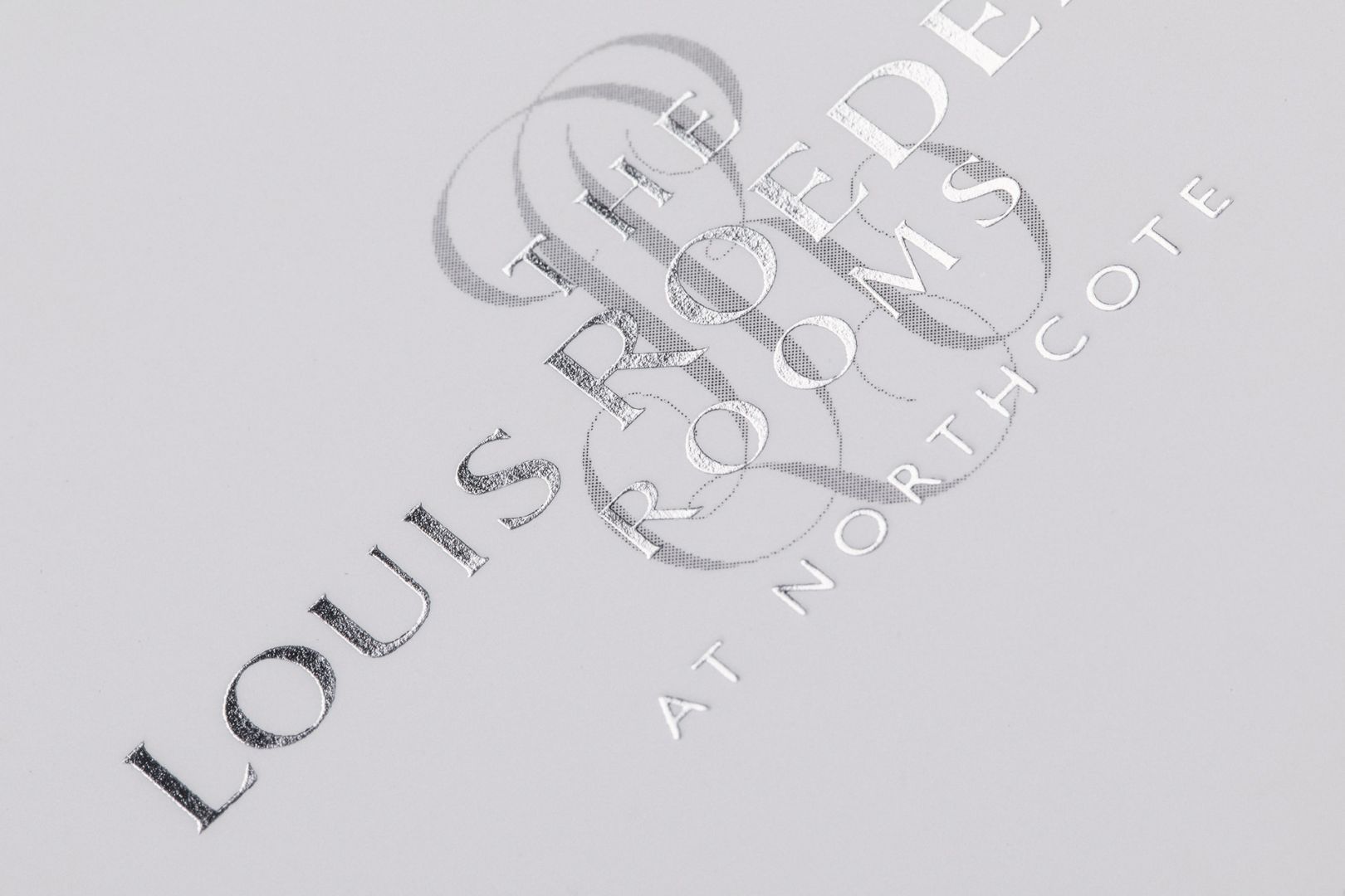 Logo for Louis Roederer Rooms at Northcote, silver text on white.